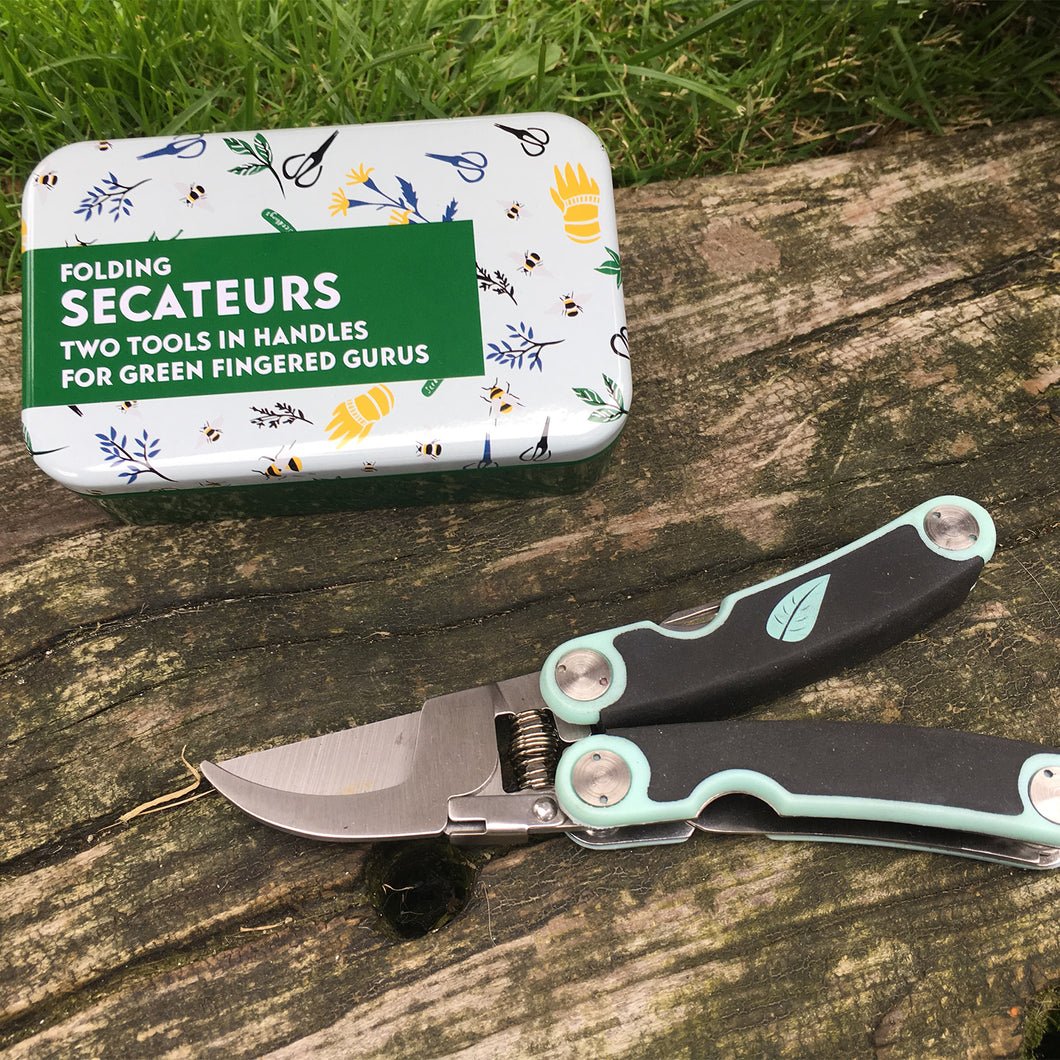 Folding pocket secateurs in a tin