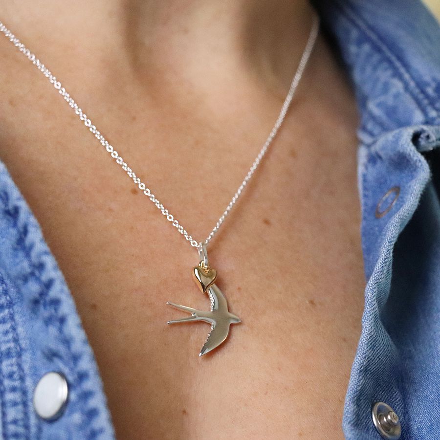 Silver plated swallow necklace with golden heart by Pom