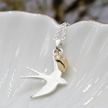 Load image into Gallery viewer, Silver plated swallow necklace with golden heart by Pom
