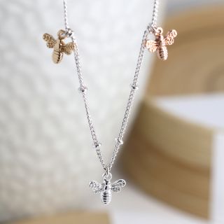 Silver plated necklace with triple mixed finish bee charms by Pom